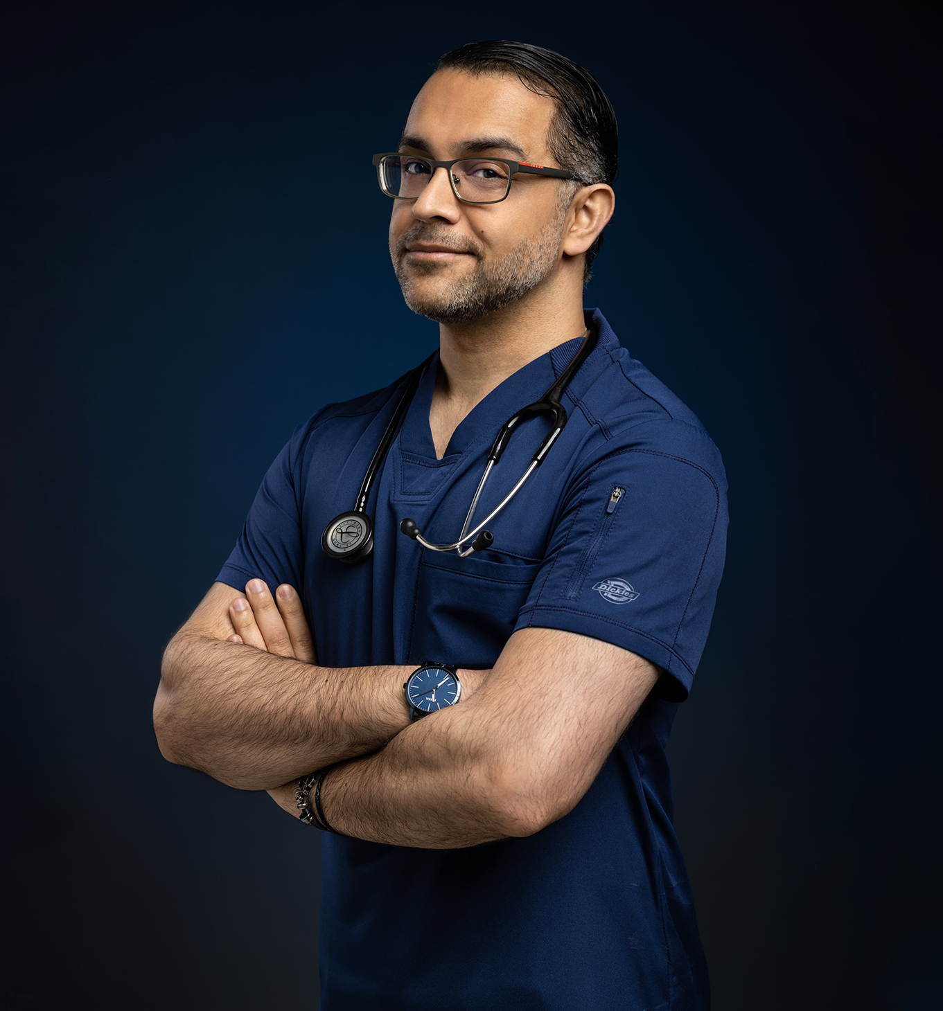 Dr. Siya, arms crossed